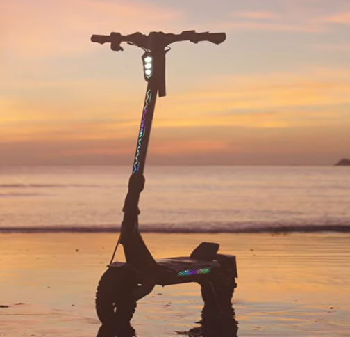 KuKirin T4 electric scooter at sunset — official manufacturer lifestyle image